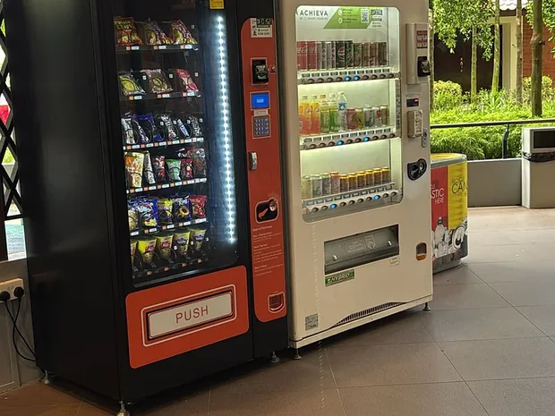 Achieva snack and drinks machines in a sheltered seating area at an elder care home