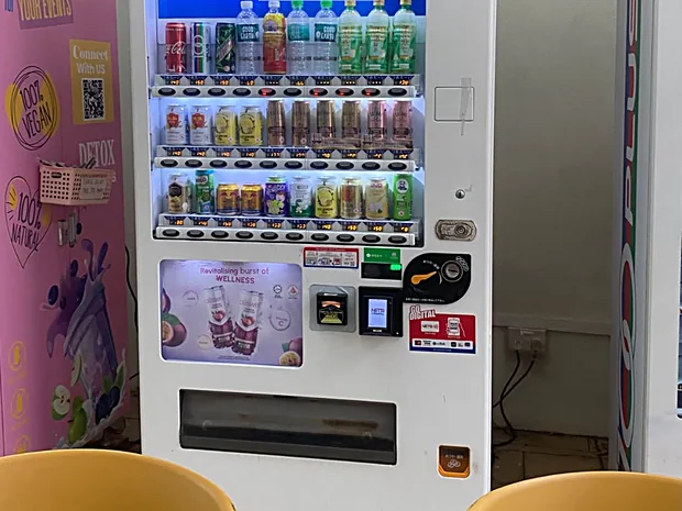 An Achieva vending machine in a student refreshment area on a Singapore campus